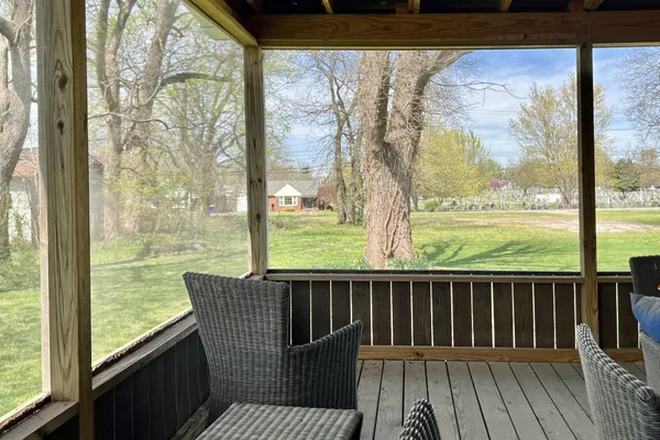 a view of a park that has large trees