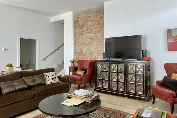 a living room with furniture and a window