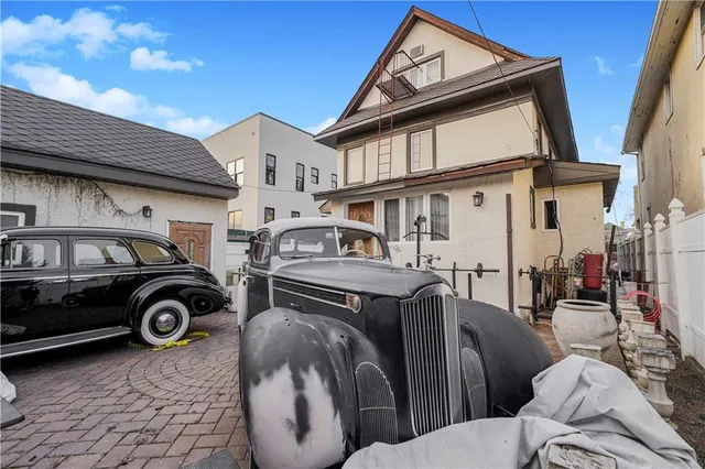 a view of a car parked in front of a building