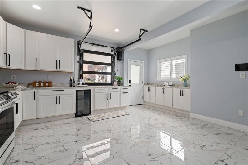 50 Southern Pittsburgh, PA 15211 - Photo 17 of 45 a kitchen with white cabinets and white appliances