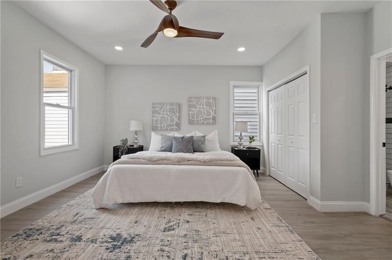 50 Southern Pittsburgh, PA 15211 - Photo 26 of 45 a spacious bedroom with a bed and a window