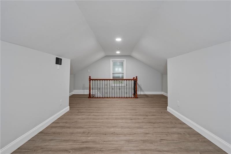 50 Southern Pittsburgh, PA 15211 - Photo 38 of 45 a view of an empty room with wooden floor and a window