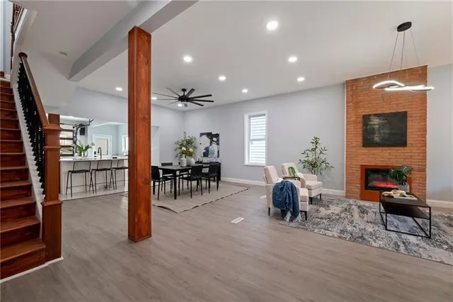 a living room with furniture and a fireplace