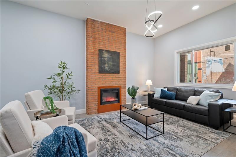 50 Southern Pittsburgh, PA 15211 - Photo 6 of 45 a living room with furniture a chandelier and a fireplace