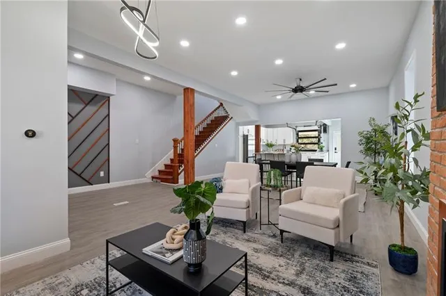 a living room with furniture potted plant and a window