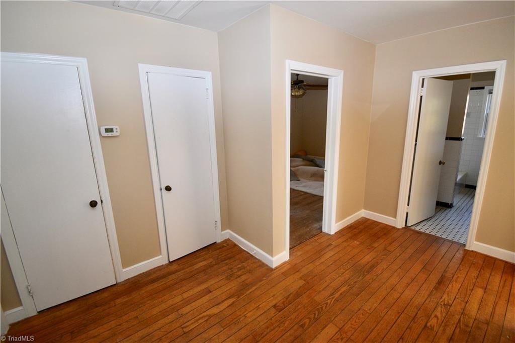 6328 Monnett Road Climax, NC 27233 - Photo 14 of 47 Open hallway with bedrooms and bath