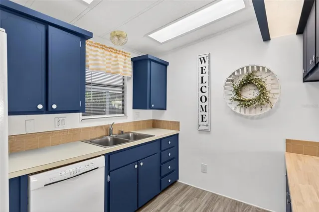 a view of a livingroom with a ceiling fan and entryway