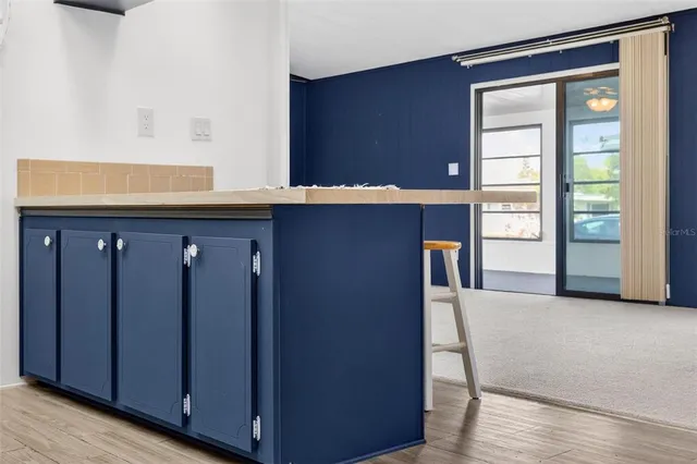 a bathroom with a sink a toilet and shower curtain