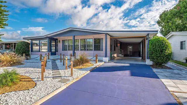 a kitchen with stainless steel appliances granite countertop a refrigerator and a stove