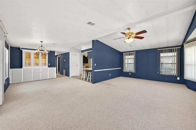 a view of a house with backyard patio and swimming pool