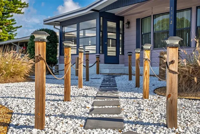 a kitchen with stainless steel appliances a refrigerator and cabinets