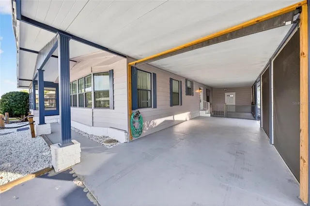 a view of a kitchen with a dining table and chairs