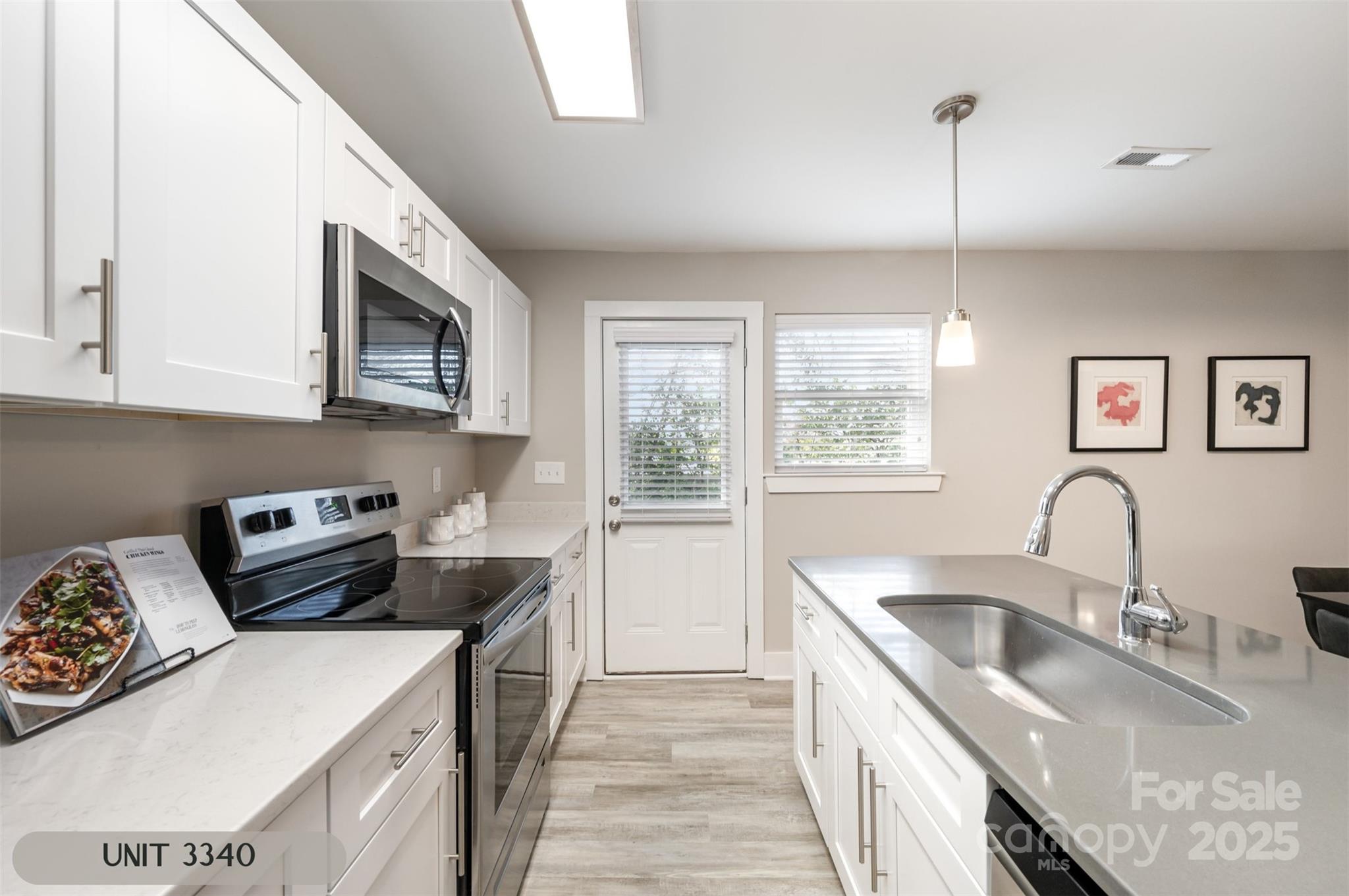 3342 Washburn Avenue Charlotte, NC 28205 - Photo 12 of 45 a kitchen that has a sink a stove and window