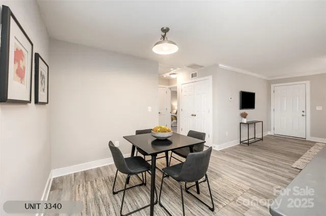 a view of a dining room with furniture and wooden floor