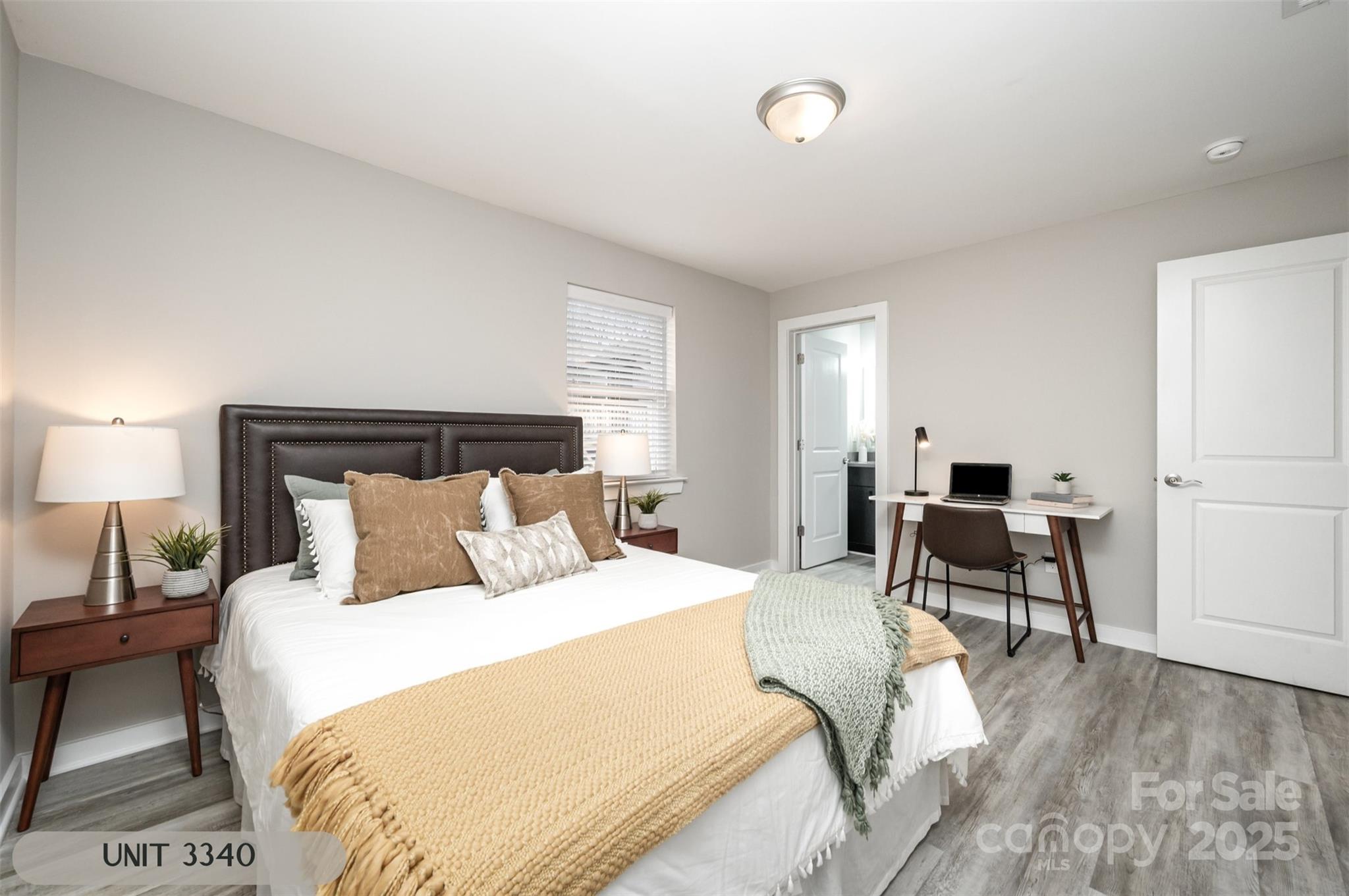 3342 Washburn Avenue Charlotte, NC 28205 - Photo 18 of 45 a bedroom with a bed and a couch