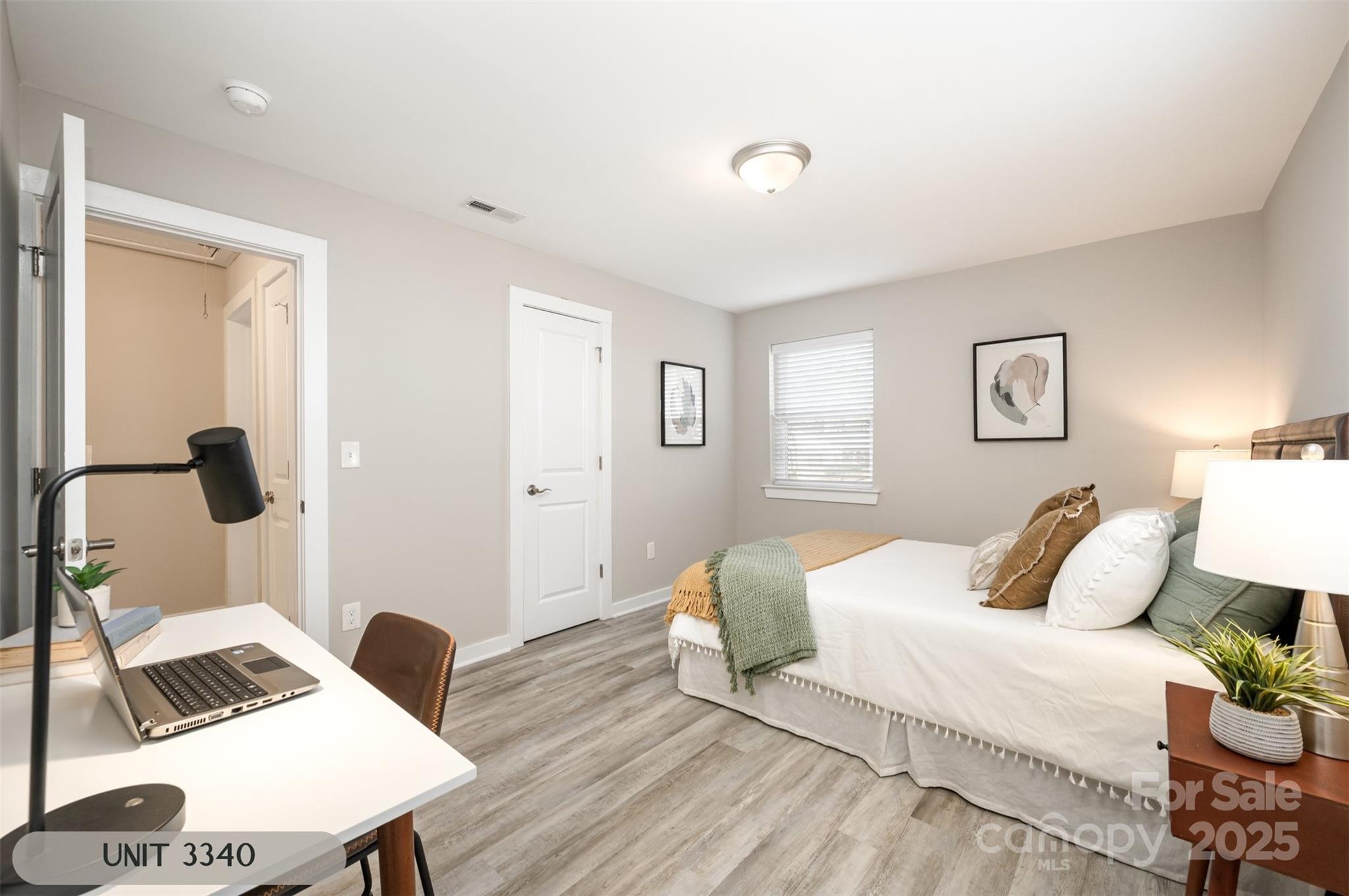 3342 Washburn Avenue Charlotte, NC 28205 - Photo 19 of 45 a bedroom with a bed and a desk