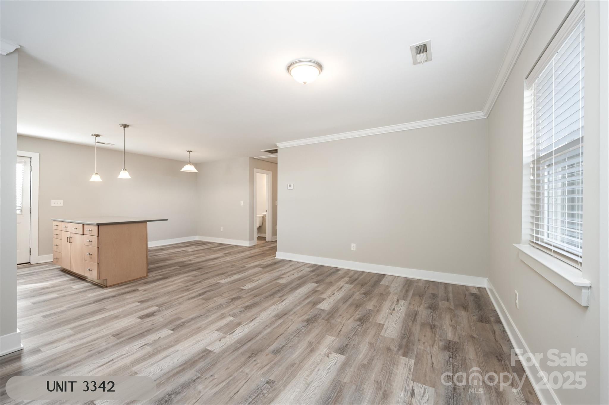 3342 Washburn Avenue Charlotte, NC 28205 - Photo 29 of 45 wooden floor in an empty room with a window