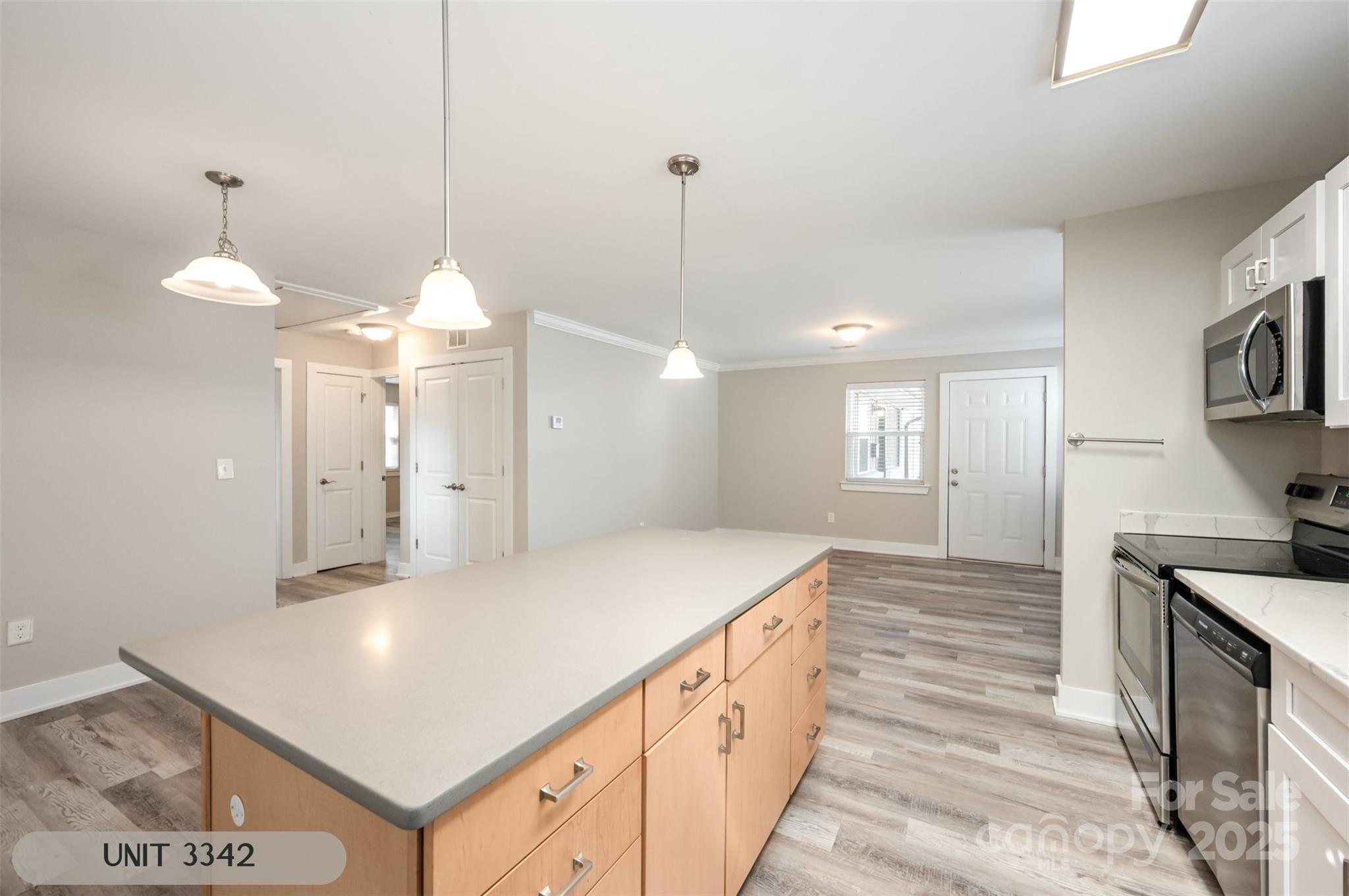 3342 Washburn Avenue Charlotte, NC 28205 - Photo 35 of 45 a kitchen with stainless steel appliances granite countertop a sink a oven a stove and a refrigerator