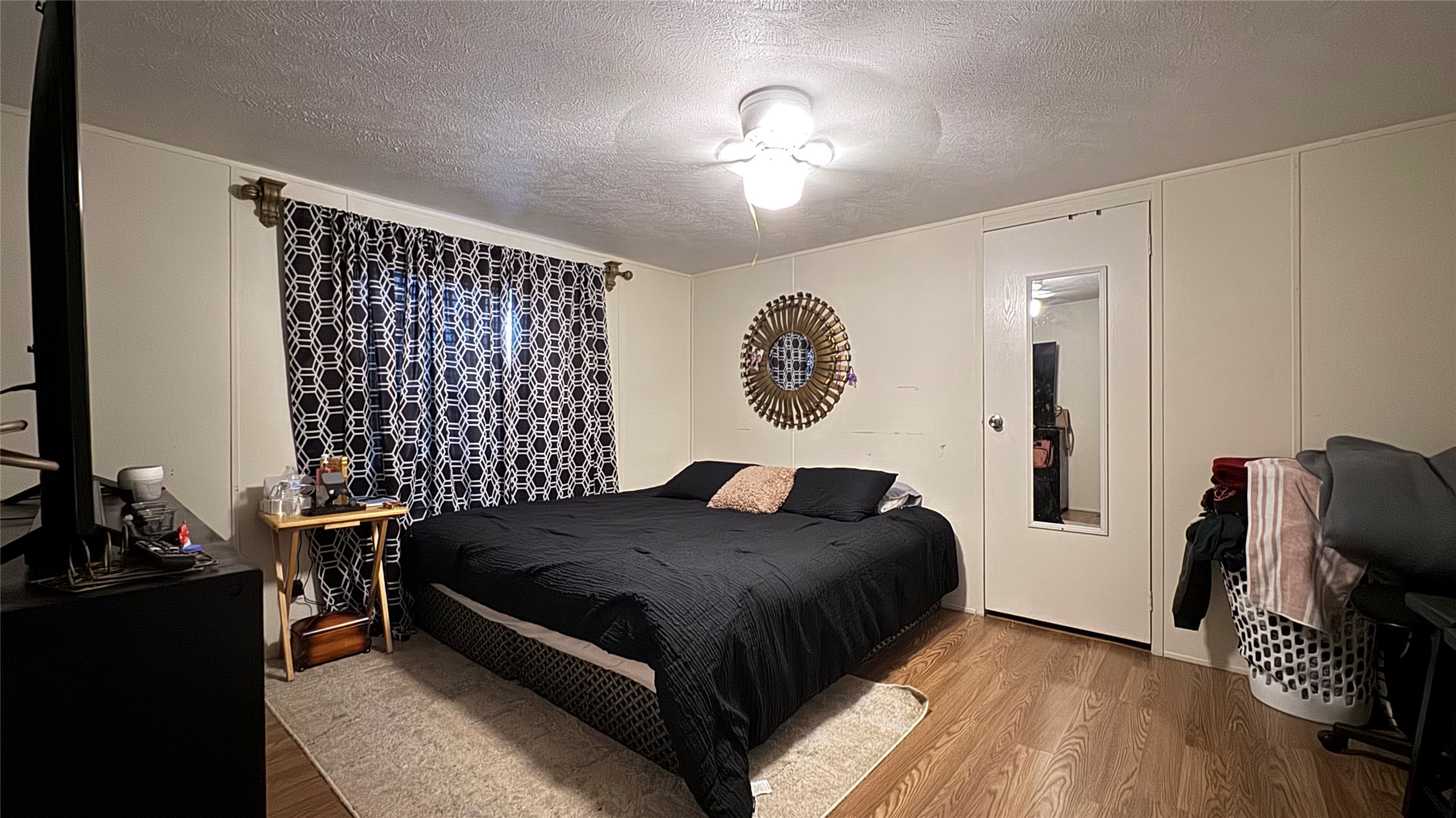 14348 West Ravine Run Willis, TX 77318 - Photo 12 of 15 a bedroom with a bed and wooden floor