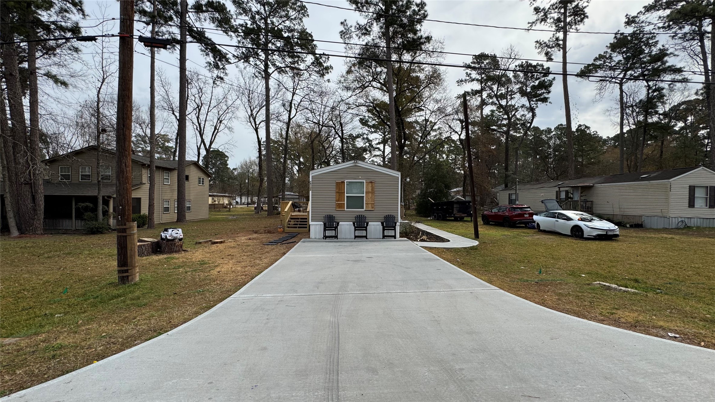 14348 West Ravine Run Willis, TX 77318 - Photo 3 of 15 a house with trees in front of it