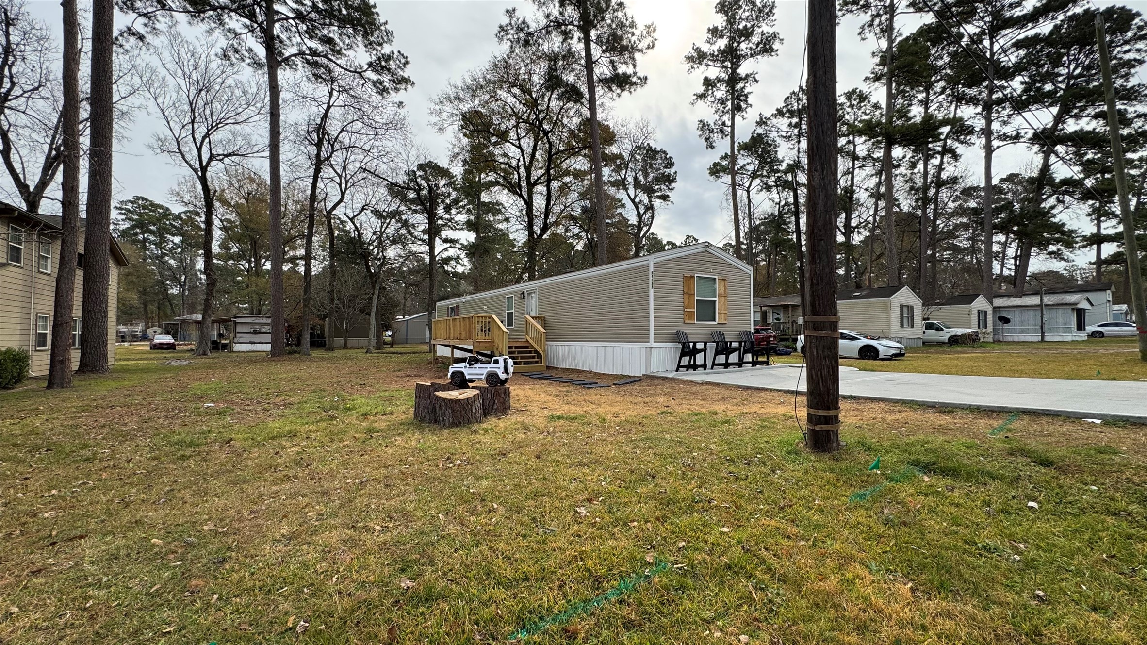 14348 West Ravine Run Willis, TX 77318 - Photo 5 of 15 a view of a park with swings and slides