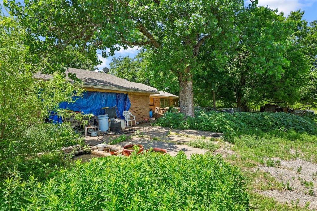 747 Vineyard Road Gunter, TX 75058 - Photo 32 of 32 a backyard of a house with seating space