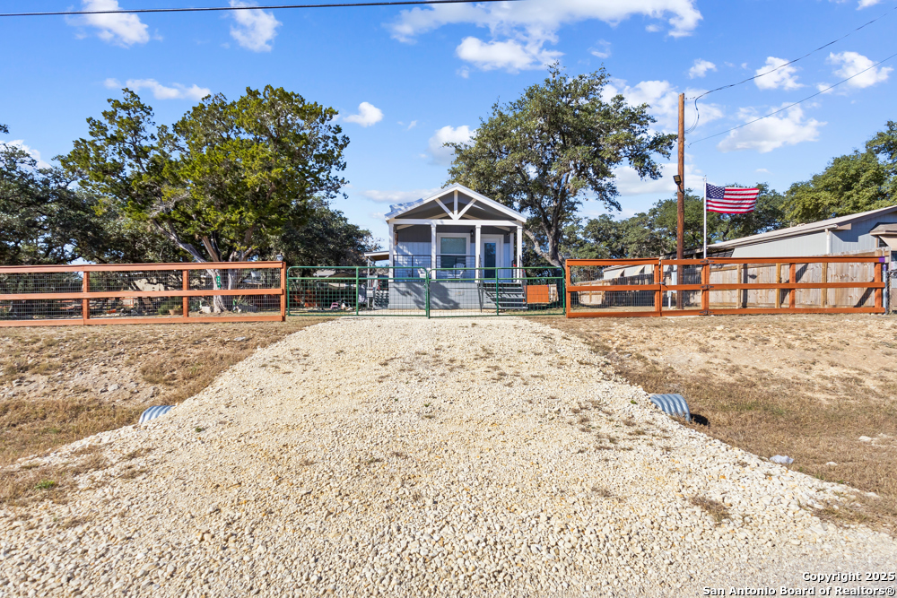 164 Private 1523 Bandera, TX 78003 - Photo 1 of 44 a view of a house with a snow on the road