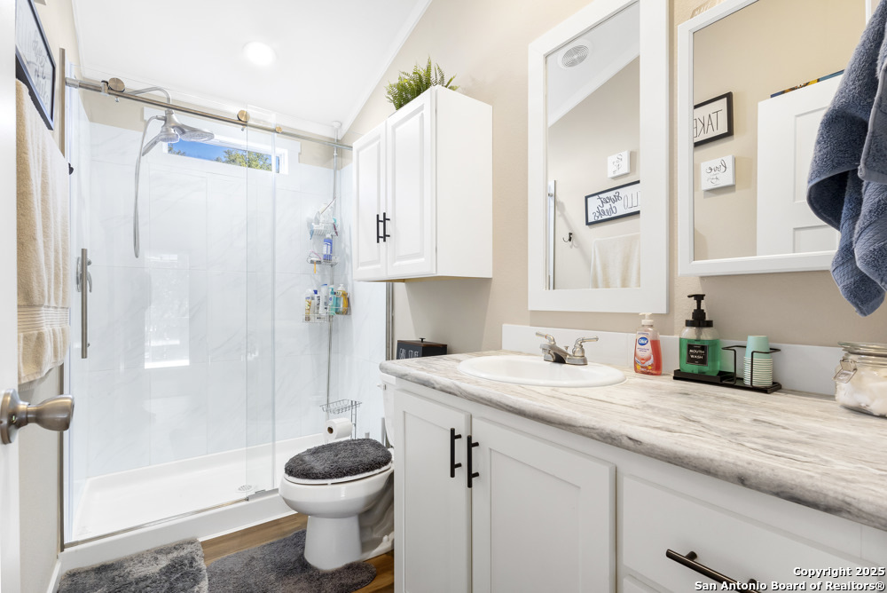 164 Private 1523 Bandera, TX 78003 - Photo 16 of 44 a bathroom with a sink a toilet and shower