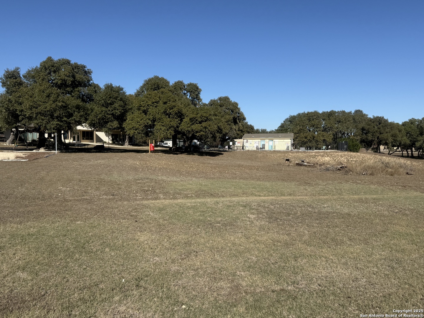 164 Private 1523 Bandera, TX 78003 - Photo 30 of 44 a view of a field with trees in the background