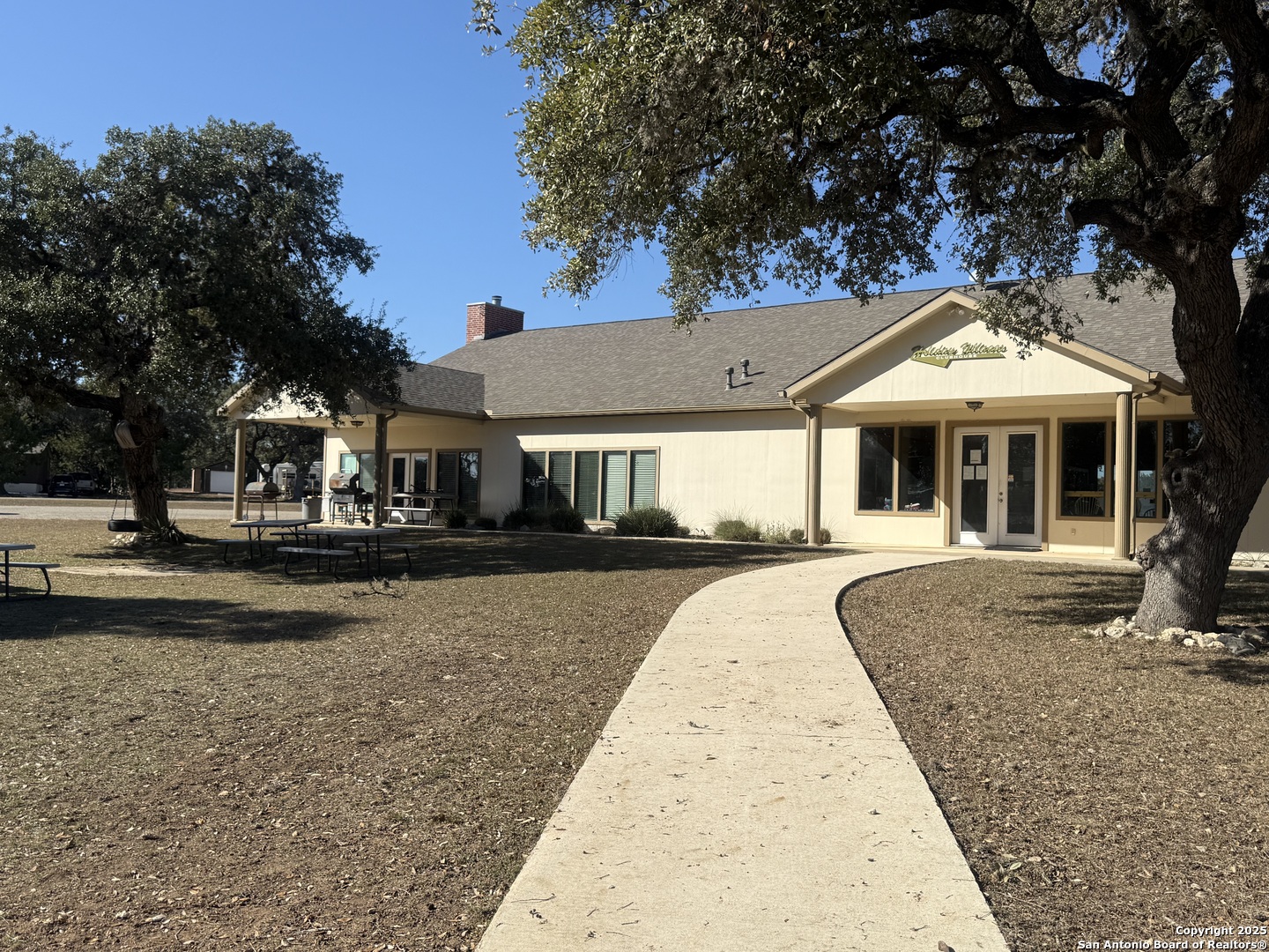 164 Private 1523 Bandera, TX 78003 - Photo 34 of 44 a front view of a house with a yard