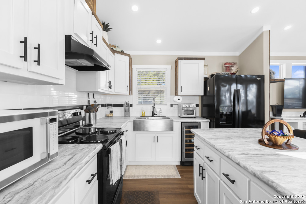 164 Private 1523 Bandera, TX 78003 - Photo 8 of 44 a kitchen with a sink dishwasher stove and refrigerator