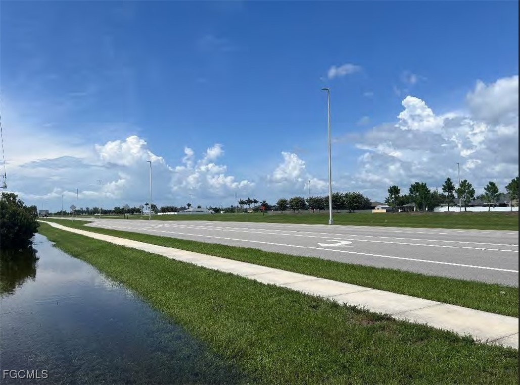 6 Burnt Store Road Cape Coral, FL 33991 - Photo 3 of 4 a view of a lake with a big yard