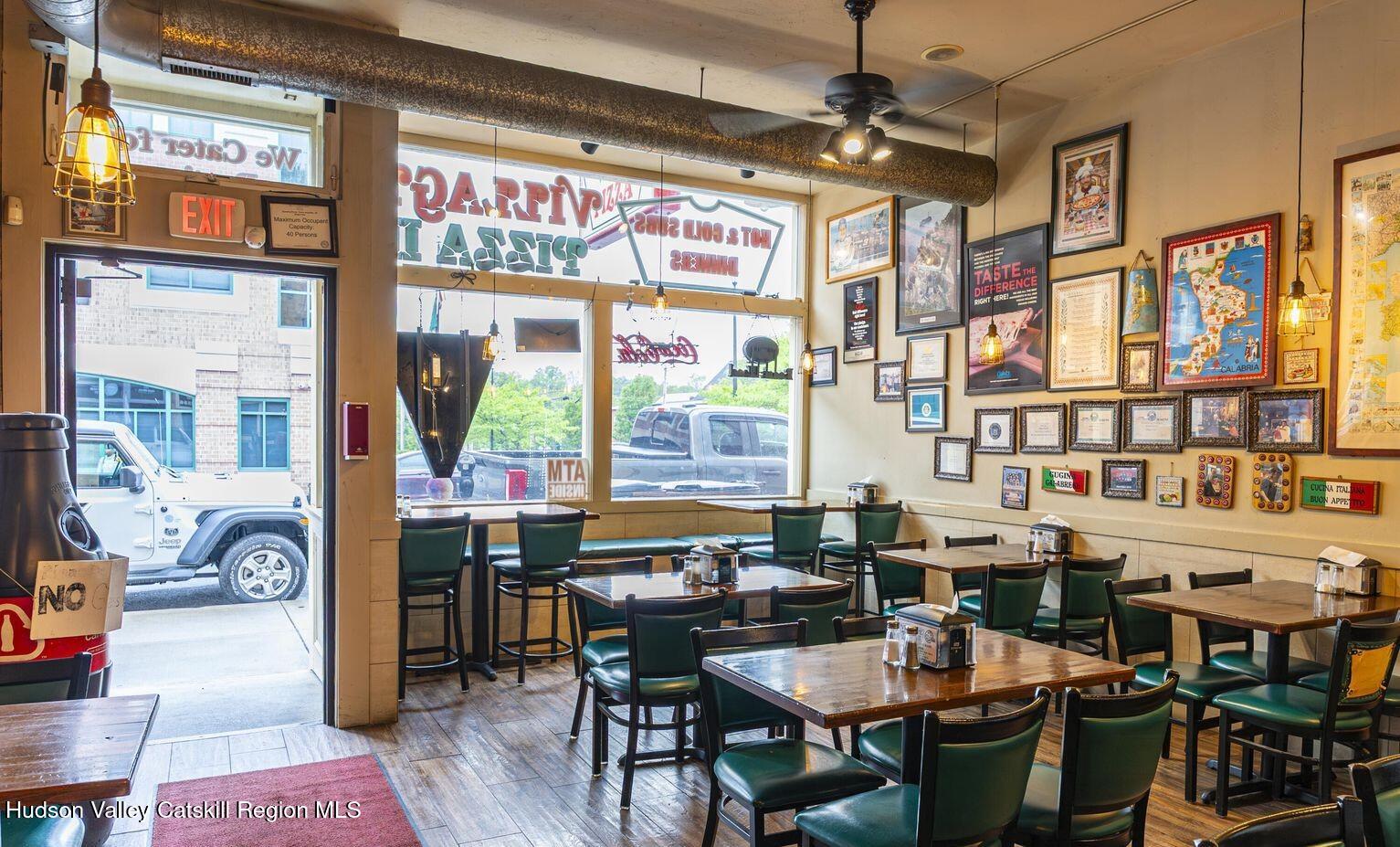 416 Main Street Catskill, NY 12414 - Photo 7 of 12 a view of a dining room with furniture window and wooden floor