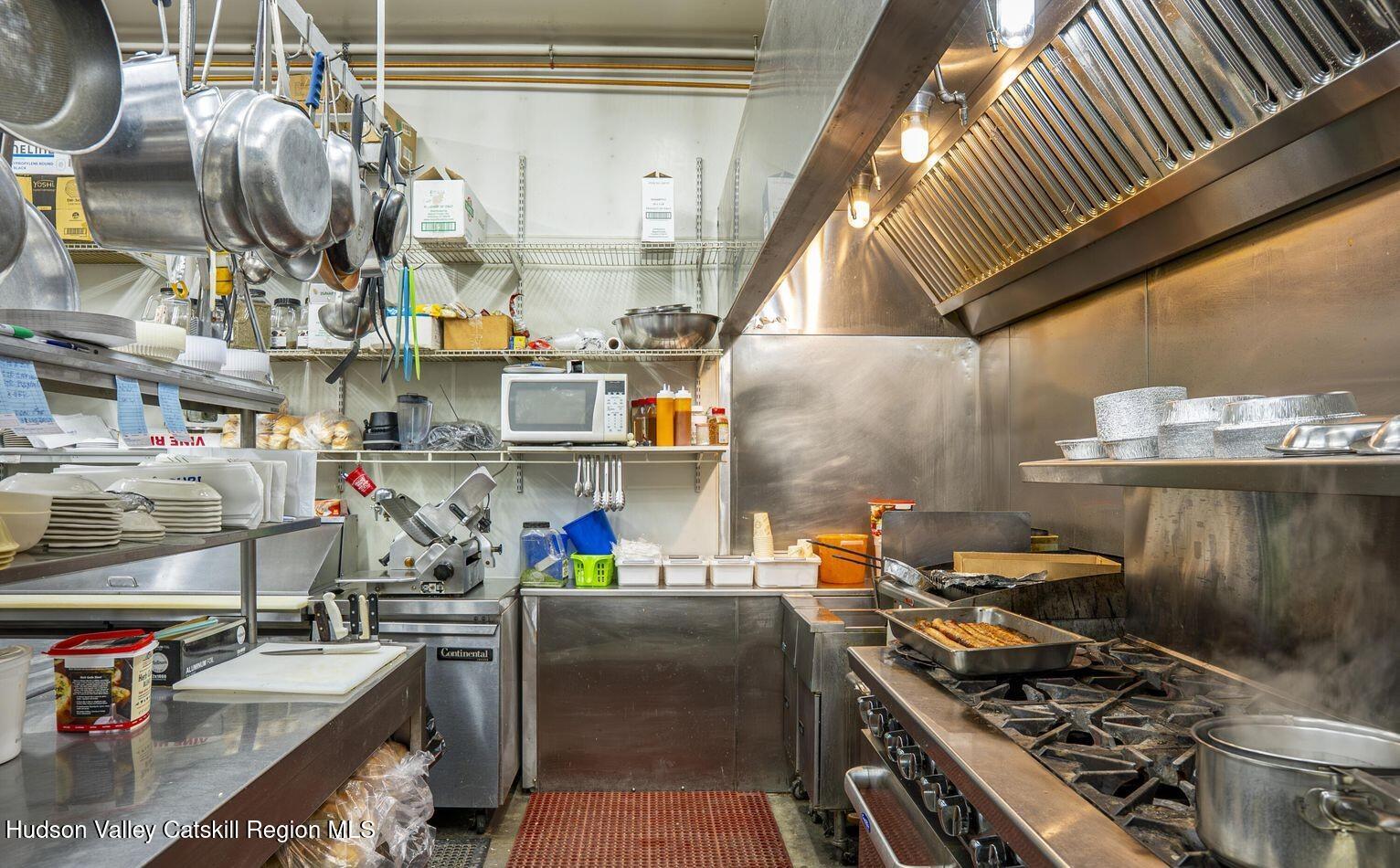 416 Main Street Catskill, NY 12414 - Photo 8 of 12 a kitchen with a stove and a sink