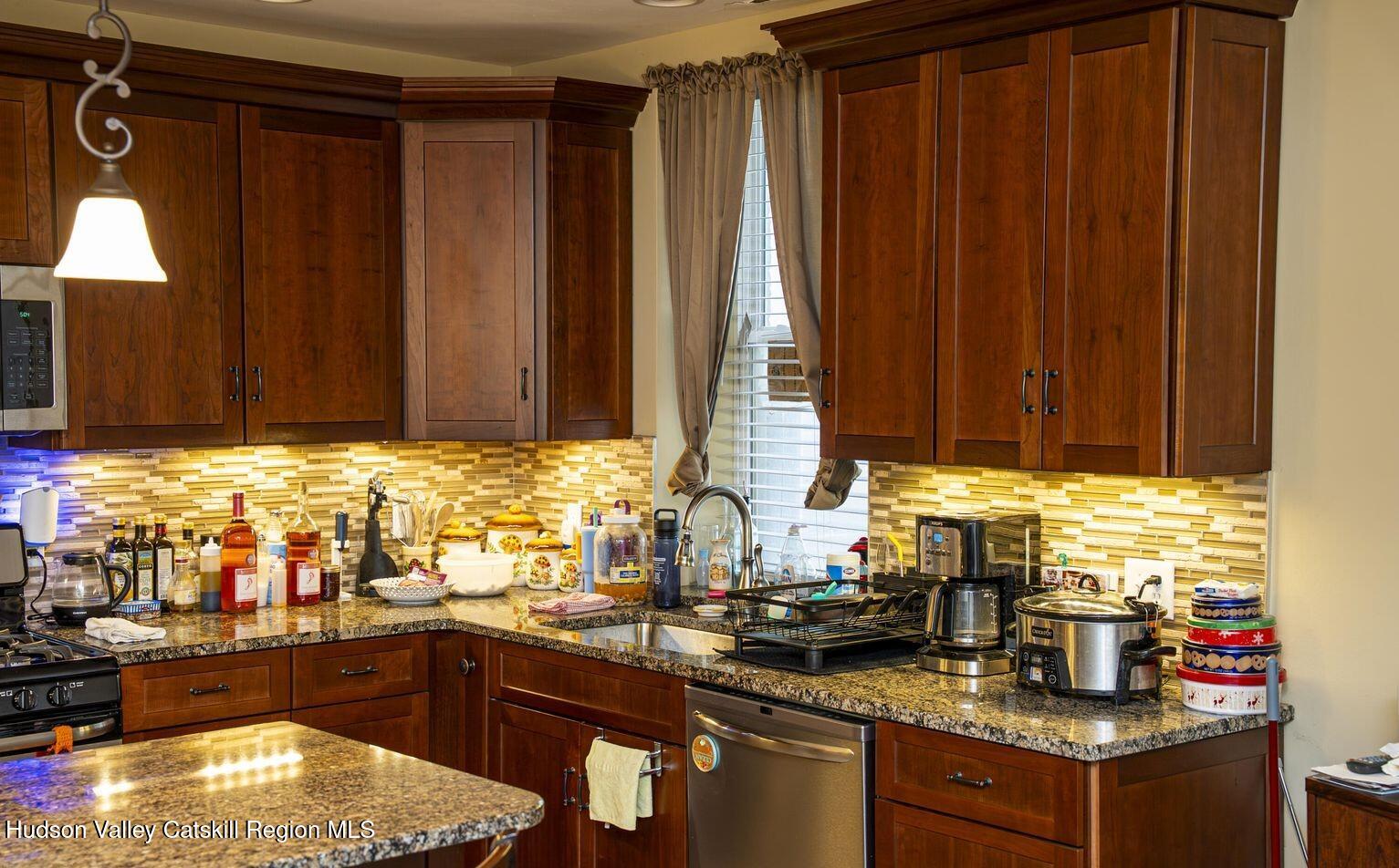 416 Main Street Catskill, NY 12414 - Photo 10 of 12 a kitchen with sink cabinets and window