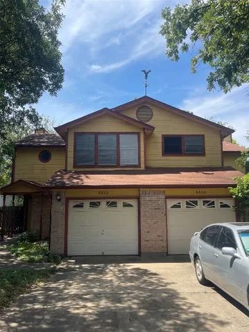 a front view of a house with a garage