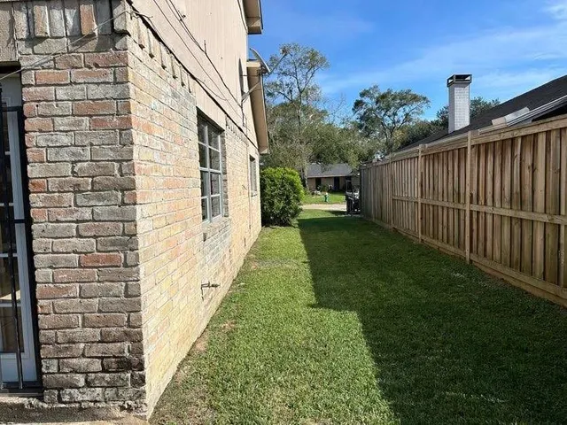 a view of a back yard of the house