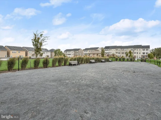 a view of a porch with wooden floor and floor to ceiling window