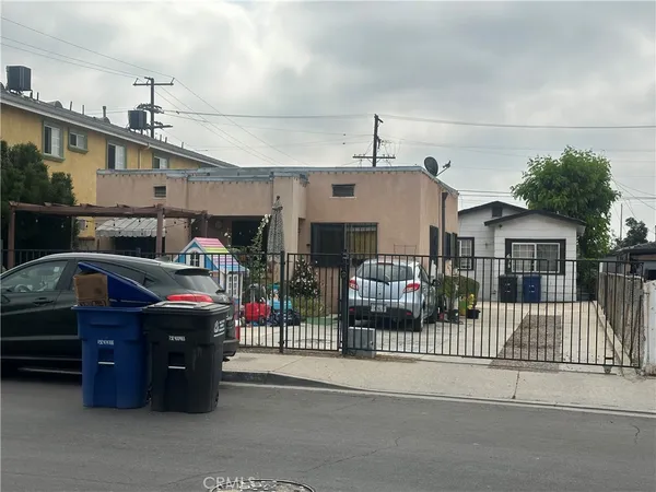 a front view of a house with a street