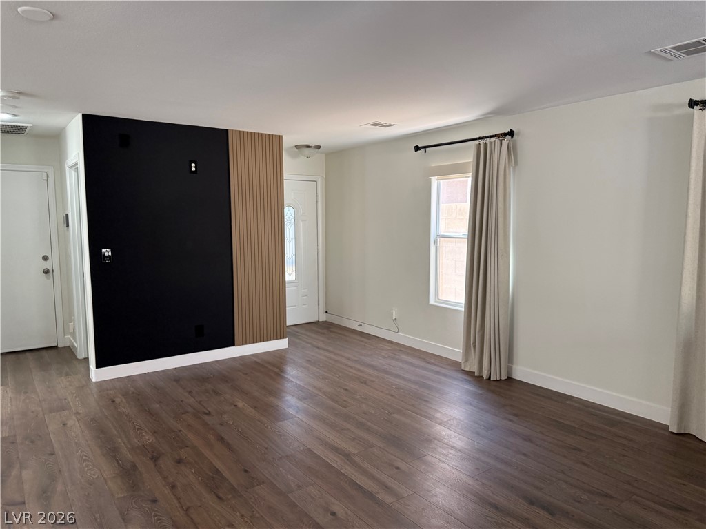 1141 Cathedral Ridge Street Henderson, NV 89052 - Photo 10 of 77 This versatile living area features durable flooring and ample natural light, ideal for modern living.