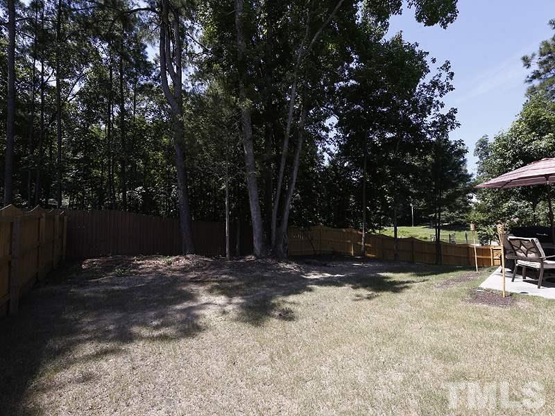 4104 McGrath Way Raleigh, NC 27616 - Photo 22 of 25 a view of outdoor space with deck and yard