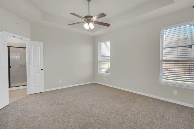a bathroom with a shower curtain and a shower curtain