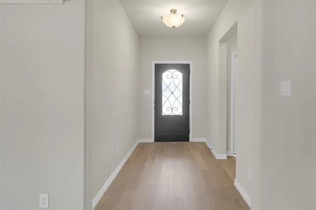 a view of hallway with windows