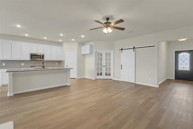 a view of kitchen with wooden floor and window