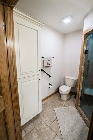 a bathroom with a toilet and a sink