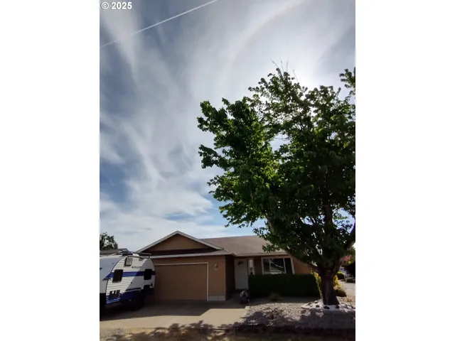 a view of house with tree in it