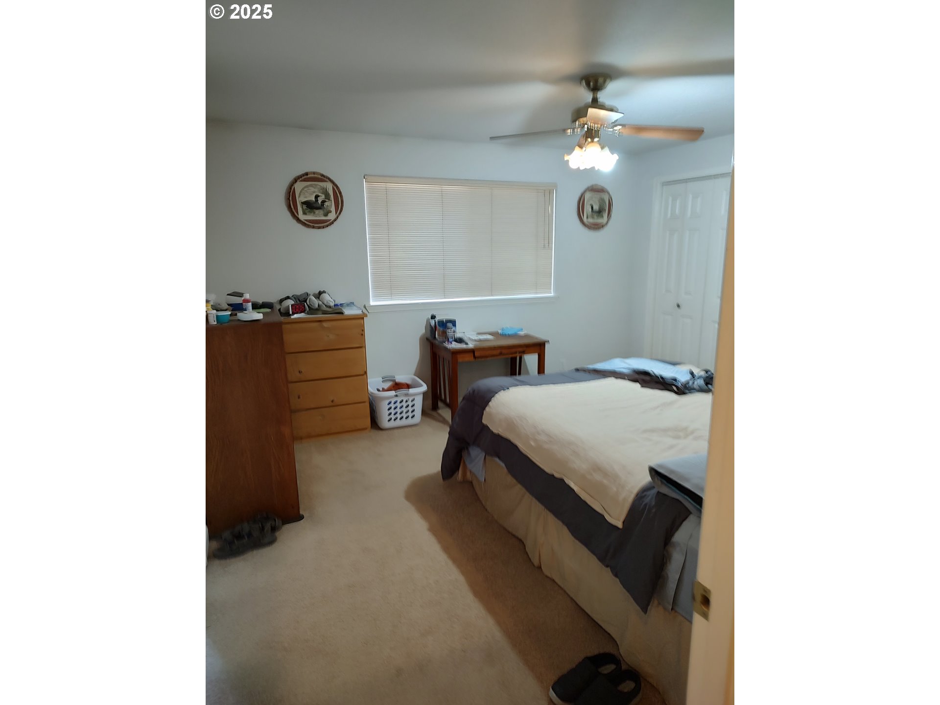 549 South 34th Street Springfield, OR 97478 - Photo 5 of 7 a bedroom with a bed and a chandelier