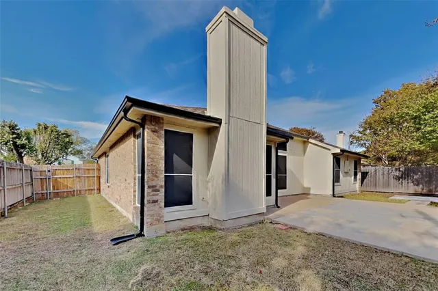 a backyard of a house with oven and garden