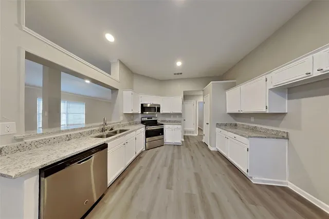 a large kitchen with a lot of counter space