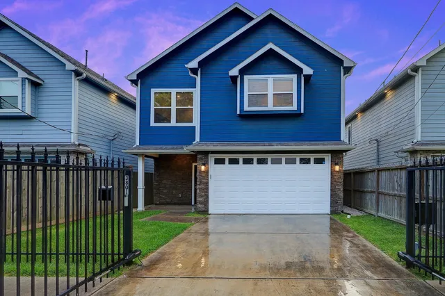 a front view of a house with yard
